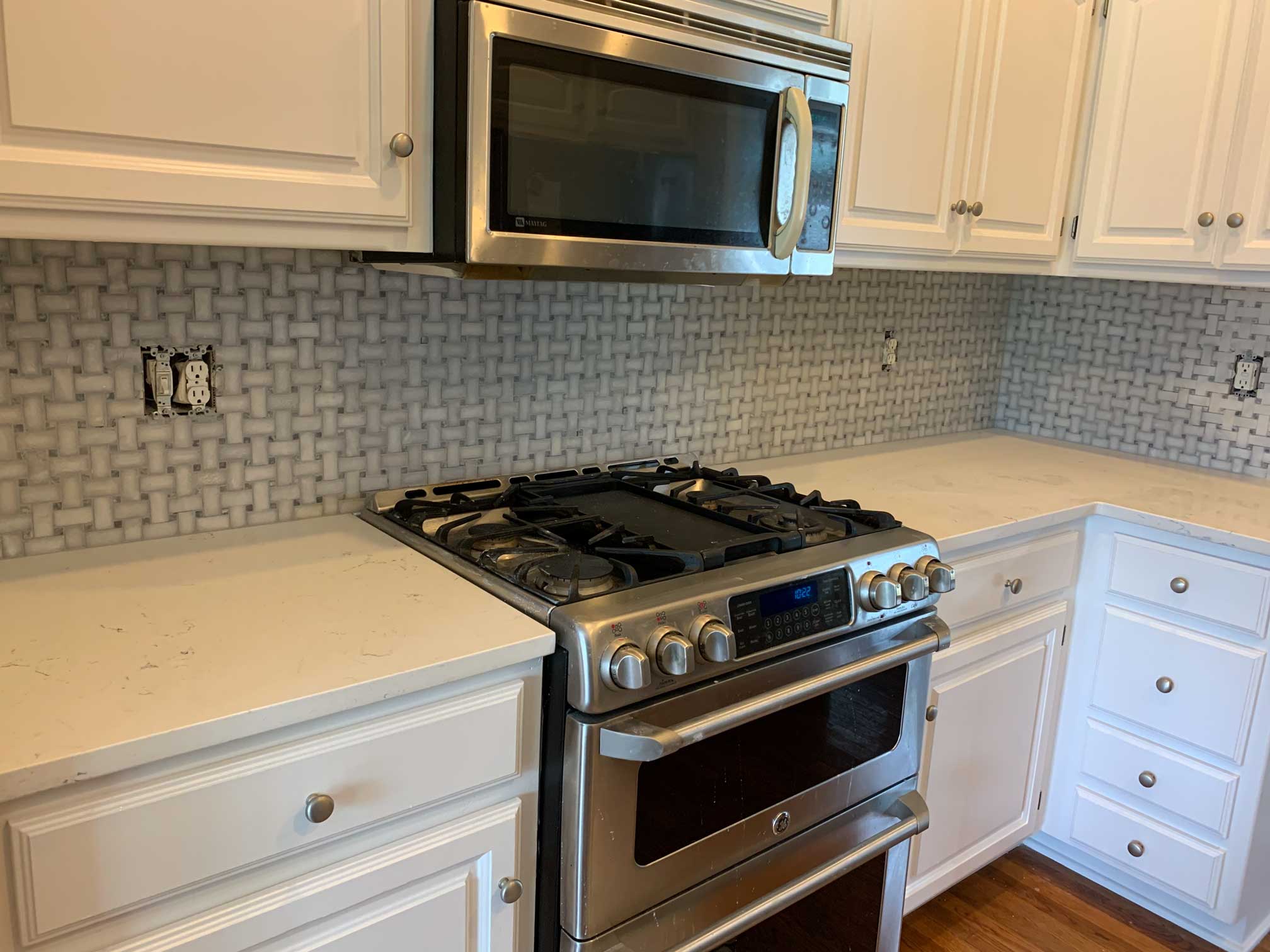 Kitchen remodel with custom backsplash and countertop